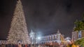 Panorama showing Commerce square illuminated and decorated at Christmas time in Lisbon night timelapse. Portugal Royalty Free Stock Photo
