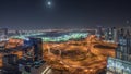 Panorama showing Dubai marina and JLT skyscrapers along Sheikh Zayed Road aerial night timelapse.