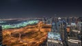 Panorama showing Dubai marina and JLT skyscrapers along Sheikh Zayed Road aerial night timelapse.