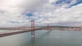 Panorama showing Lisbon cityscape and Tagus river timelapse with 25 of April bridge Royalty Free Stock Photo