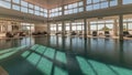 Panorama showing luxury indoor swimming pool, part of hotel timelapse Royalty Free Stock Photo