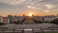 Panorama showing sunset over lawn at Alameda Dom Afonso Henriques and the Luminous Fountain aerial timelapse in Lisbon. Royalty Free Stock Photo