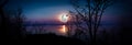 Panorama. Silhouettes of woods and beautiful moonrise, bright full moon would make a great picture. Outdoors.