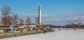 Panorama of he silver lighthouse at the frozen Paterswoldse Meer lake in Groningen