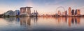 Panorama of Singapore city skyline at business modern downtown building area in sunrise with cloud and sun light and reflection Royalty Free Stock Photo