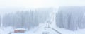 Panorama of ski resort Kopaonik, Serbia, skiers, lift, pine trees, snowfall