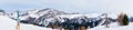 Panorama of Skiers on Chairlift Up a Ski Slope in the Canadian Rockies