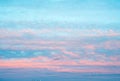 Panorama of sky with pink clouds at sunset or sunrise. Abstract background with pink, purple and blue colors clouds. Light pink Royalty Free Stock Photo