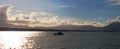 Panorama: Small boat going slowly over the water Royalty Free Stock Photo