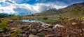 Panorama of small high mountain lake Royalty Free Stock Photo