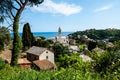 Panorama of small town Arenzano in Liguria and famous church `GesÃ¹ Bambino di Praga` in the background Royalty Free Stock Photo