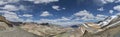 Panorama of snow capped mountains road and valley from Tanglang La pass Royalty Free Stock Photo