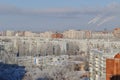 Panorama of snow-covered residential areas of the Avtozavodsky district in the rays of the morning sun.