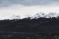 Panorama of snowing mountains of Alps and clouds at evening Royalty Free Stock Photo