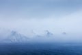 Panorama of snowy fjords and mountain range, Senja, Norway Amazing Norway nature seascape popular tourist attraction. Royalty Free Stock Photo