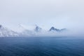 Panorama of snowy fjords and mountain range, Senja, Norway Amazing Norway nature seascape popular tourist attraction. Royalty Free Stock Photo