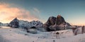 Panorama of snowy mountain with fishing village at sunset Royalty Free Stock Photo