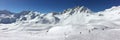 Panorama of snowy mountain peaks and ski slopes at Tignes, ski resort in the Alps France Royalty Free Stock Photo