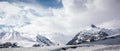 Panorama of snowy mountains. Caucasus Mountains, Georgia, view from ski resort Gudauri Royalty Free Stock Photo