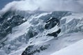 Panorama of snowy mountains and high alpine peaks in wintery Bernese Oberland in Switzerland