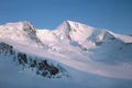 Panorama of snowy mountains and high alpine peaks in wintery Bernese Oberland in Switzerland Royalty Free Stock Photo