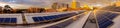 Panorama of solar panels on rooftop Royalty Free Stock Photo