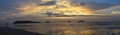 Panorama of spectacular sunset on deserted beach with bright colors and no people with palm trees on Koh Chang Island, Thailand