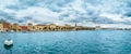 Panorama of Split waterfront with old town, Riva promenade, palm trees and a boat, Croatia