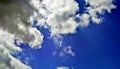 Panorama of spring, summer clouds on a blue sunny sky, background, texture. Royalty Free Stock Photo