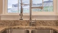 Panorama Stainless steel double basin sink and faucet inside the kitchen of a home Royalty Free Stock Photo