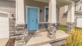 Panorama Stape and arched entrance at the porch of home with pastel blue front door Royalty Free Stock Photo