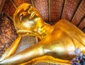 Panorama of statue of Reclining Buddha in temple Wat Pho, Bangkok Royalty Free Stock Photo