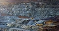 Panorama of stepped wall of diabase quarry with two stone crushing machines Royalty Free Stock Photo