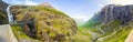 Panorama of Stigfossen waterfall under bridge and Trollstigen road, Norway Royalty Free Stock Photo