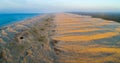 Panorama of Stockton beach sand dunes at sunrise.