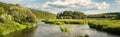 Panorama of the summer landscape on the banks of the Ural river with forest, Russia