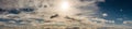 Panorama of sun breaking through clouds malestrom Royalty Free Stock Photo