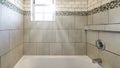 Panorama Sun flare Alcove bathtub shower combo with ceramic and subway tiles wall with mosaic tiles trim in the middle