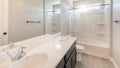 Panorama Sun flare Interior of a white bathroom with black bathroom fixtures and light gray tiles flooring Royalty Free Stock Photo