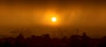 Panorama of sun setting behind heavy tropical rain storm Royalty Free Stock Photo