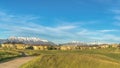 Panorama Sunny day view of pathway amid grassy ground leading to homes and golf course Royalty Free Stock Photo