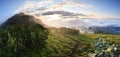 Panorama of sunrise in misty mountains