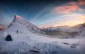 Panorama of sunrise over snowy mountain range with mountaineer tent camping in winter on Segla Mount at Senja Island