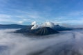 Panorama sunrise view of Mount Bromo, still active volcano and part of the Tengger massif with mist and cloud from vocalno crater Royalty Free Stock Photo