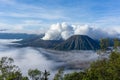 Panorama sunrise view of Mount Bromo, still active volcano and part of the Tengger massif with mist and cloud from vocalno crater. Royalty Free Stock Photo