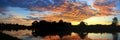 Panorama sunset beautiful colorful landscape and silhouette tree mountain river reflect in sky twilight time Royalty Free Stock Photo