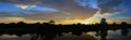 Panorama sunset beautiful colorful landscape and silhouette tree mountain river reflect in sky twilight time Royalty Free Stock Photo