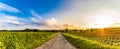 Panorama, sunset over fields and Austrian village with dramatic sky Royalty Free Stock Photo