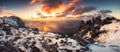 Panorama of Sunset over Norwegian sea and rugged snowy ridge at Ryten mountain Royalty Free Stock Photo