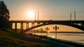 Panorama of sunset over river, modern bridge and city embankment, beautiful urban evening landscape Royalty Free Stock Photo